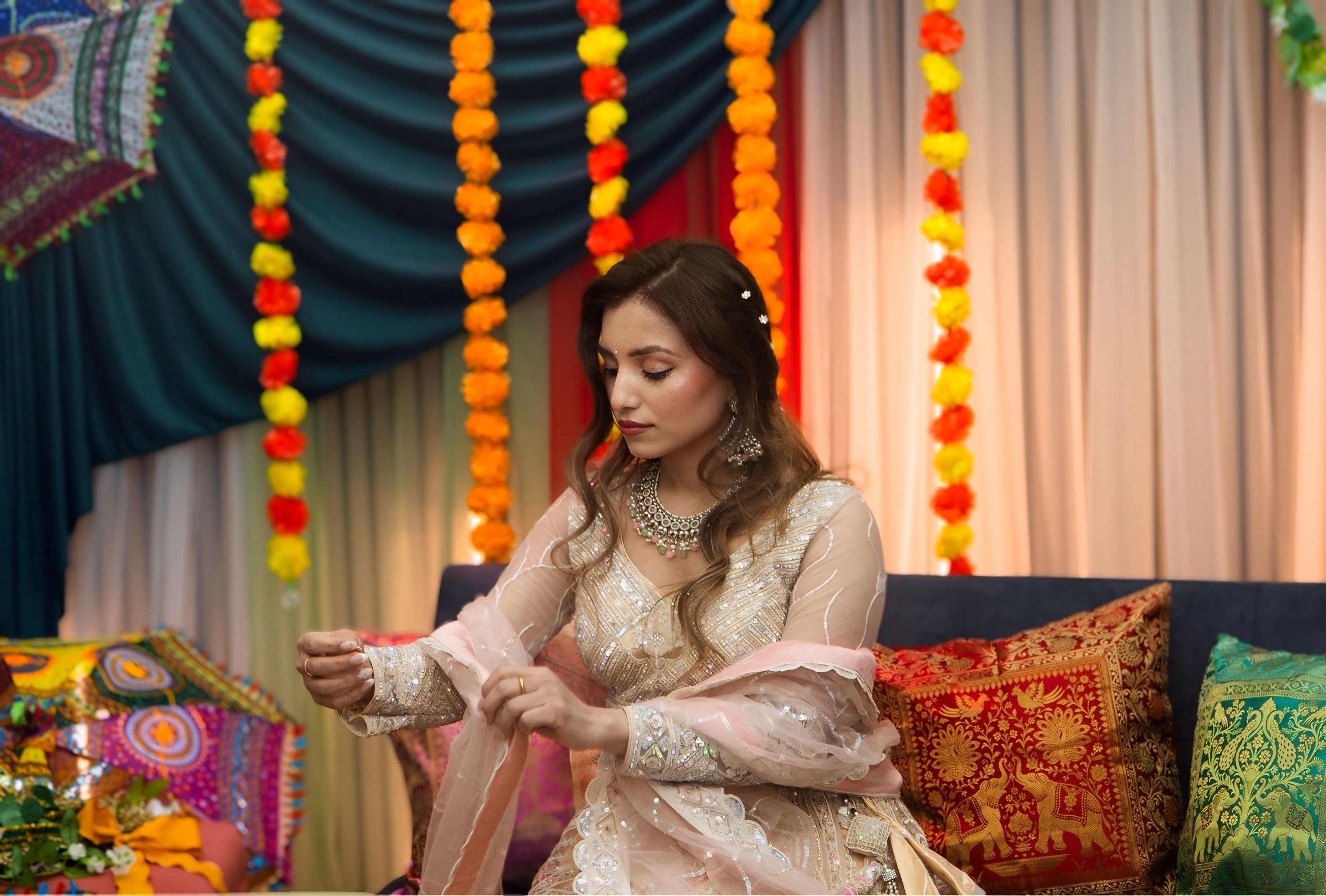 Candid bridal moment — bride in elegant lehenga at mehndi ceremony